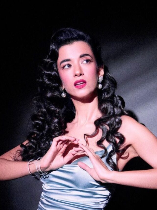 Saba Azad poses in a gray satin slit dress and writes “What’s your vintage?”