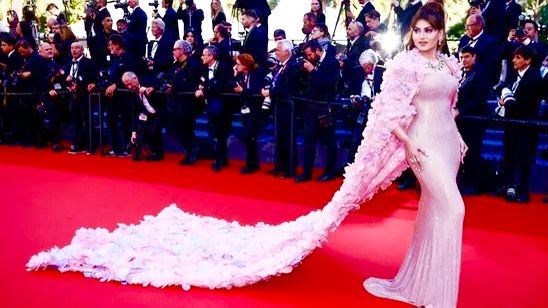 Did You Know? Urvashi Rautela's stunning pink and lavender gown at the premiere of L'AmourOuf along with Bella Hadid & Heidi Klum at the 77th Festival de Cannes took 61000 hours to get completed? Designer Michael Cinco shares details