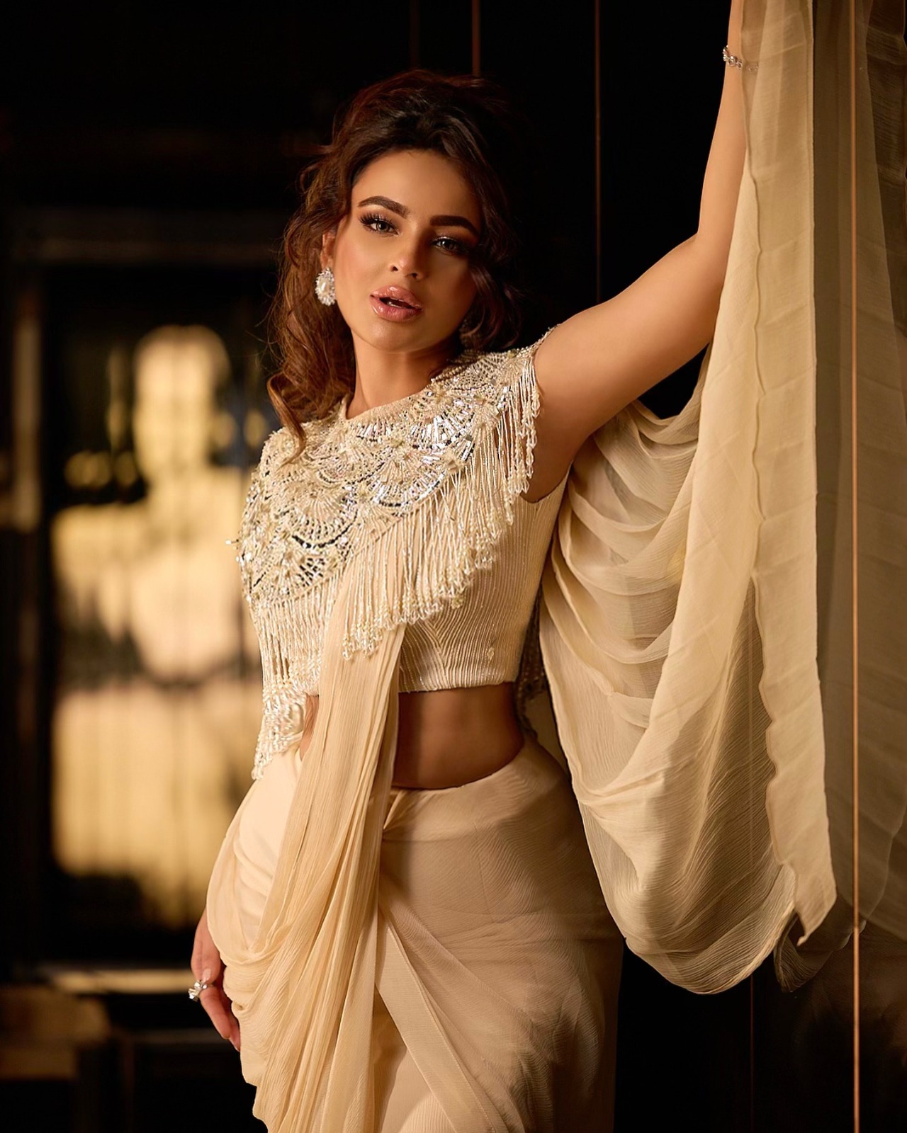 Seerat Kapoor Takes Us Back To 80's Era With Her Personal Style Touch As She Dons An Ethnic Embellished Cape with a Crop Top and Draped Saree Costing Over 1Lakh Rs.